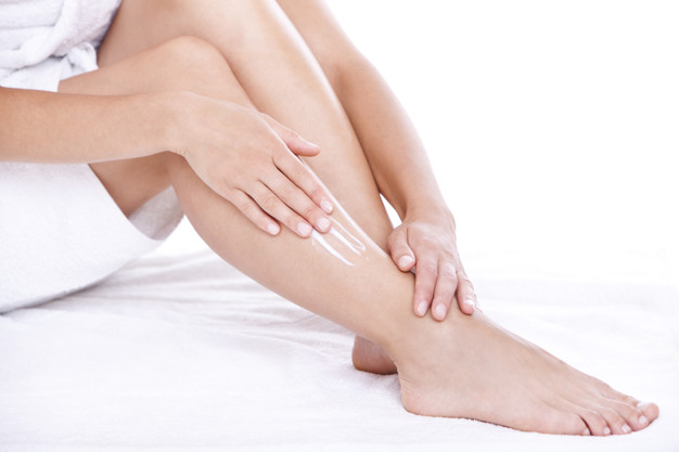 woman-applying-moisturizer-cream-legs_144627-25925